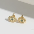 Golden Evil Eye stud earrings with blue zirconia and sunburst design details - Sunburst Blue Eye