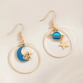 Vintage gold hoop earrings featuring blue moon and star pendants on fabric background - KC Gold (11221)