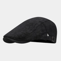 Detail of adjustable bronze buckle on dark grey linen flat cap for custom sizing - Black