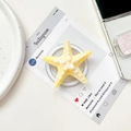 Close-up of a yellow starfish phone grip with textured surface and retractable base - Magnetic Stand / Yellow