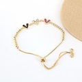 Macro detail of adjustable gold heart bracelet with blue and purple cubic zirconia - Blue/White/Rose Red (BR10803-8)