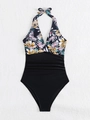 Detail of floral halter neck one-piece swimsuit with ruched slimming black bottom - S / Black with Floral Print
