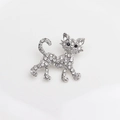Silver-toned cat brooch with white rhinestones and black gem eyes in a walking pose - Silver Rhinestone Cat (136)