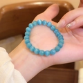 Vista detallada de pulsera de cuentas de piedra ojo de gato azul claro con efecto - 8mm / Azul