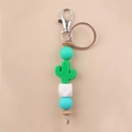Detail of DIY cactus silicone bead keychain with mint green wood beads and metal ring - Green