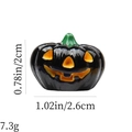 Detail view of small black resin Halloween pumpkin charm with dimensions and 7.3g weight - Black Smiling Pumpkin