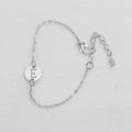 Silver thin chain bracelet with circular hollow pendant featuring engraved letter E - Silver E