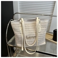 Detail of cream woven straw tote bag with brown leather handles and Suemm embroidery - No Pendant / Off White
