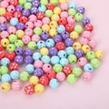 Colorful acrylic beads with silver star patterns for DIY jewelry making on pink surface - 8mm Colorful Star Beads With Silver (100pcs)