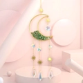 Detail of moon suncatcher with green crystal stones and hanging crystal prisms - Green Aventurine