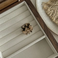 Detail of a leopard print hair claw clip on velvet lining inside a wooden jewelry box - Mini Round Claw