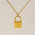 Minimalist gold lock pendant necklace featuring a Gothic style letter U engraving - Letter U Style