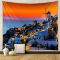 Detail of Santorini sunset tapestry with blue domes and white buildings on a textured wall - 73*95CM / Santorini Twilight Town (Brushed)