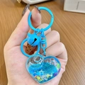 Blue heart-shaped quicksand keychain with blue liquid, glitter and mini bell charm - Blue Heart Sparkle
