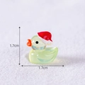 Glow-in-the-dark yellow duck figurine with a red Christmas hat, measuring 1.7cm - Green