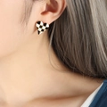 French style heart stud earrings with black and white checkerboard pattern on a model - Gold Heart (F758)
