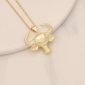 Macro view of gold bull head pendant featuring cubic zirconia stones on an O-chain - Zircon Horns O-Chain Bull Style (17#)