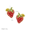 Detailed view of 14mm strawberry earrings featuring red enamel and green crystals - Strawberry Studs - Red Enamel Green Gem