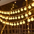 Solar outdoor string lights with warm yellow frosted globe bulbs for garden decor - Round Ball (Warm) / Solar: 12m 100 LEDs