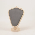 Close-up of luxury velvet necklace display stand with premium light wood frame - Log Grey