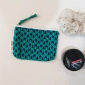 Detail of floral canvas coin purse with white zipper and green woven pull cord - Blue Green Chain