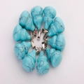 Blue turquoise patterned gourd pendants with silver clasps arranged in a circle - Turquoise Howlite