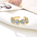 Close-up of gold-plated evil eye open ring featuring blue zircons and enamel details - Blue and Black Eye (ZYN-DMR56G-4)