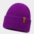 Detail shot of purple ribbed beanie showing thick texture and brown leather label - Deep purple