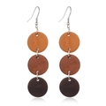 Detailed close-up of brown wooden geometric earrings with triple circular gradient discs - Style 20/Three Disc Cascade Gradient Brown