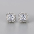 Detailed macro view of square cluster stud earrings with silver plating and zircon stones - Silver White