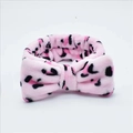 Pink leopard print coral fleece headband with a soft bow for face washing and skincare - Pink Leopard