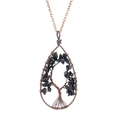 Detail of copper wire-wrapped tree of life pendant with black natural stone chips - Obsidian + Chain
