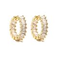 Macro shot of gold hoop earrings featuring channel-set baguette cut cubic zirconia - Style D Pair / Gold