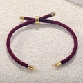 Detail of red Milan cord bracelet with adjustable gold-plated slider and metallic ends - Burgundy