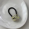 Black high-elastic hair tie featuring a minimalist wavy gold metal ornament buckle - Hollow Water Pattern Gold