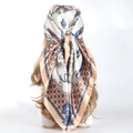 Silk-satin headscarf with chain and tassel patterns in beige and orange on a model - 90*90cm / Coin Khaki