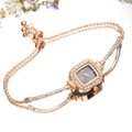 Square quartz watch with rose gold chain bracelet and rhinestone bezel on mirror background - Black Dial Rose Gold Strap