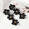 Elegant long black floral drop earrings with gold stamen and matte finish on white background - Black