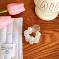 Elegant round pearl hair claw clip with white faux pearls on a warm wooden tabletop - No. 31 Round Large Beads 4cm