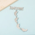 Detailed view of silver MOM pendant with baby feet charms and diamonds on blue background - Silver Tone MOM + 4 Feet Pendant