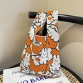 Orange knitted tote bag with white cartoon bunny pattern and soft integrated handle - Orange Rabbit