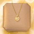 Elegant gold heart pendant necklace with shimmering zircon stones on warm silk background - Gold-Center Main Stone Pave Heart