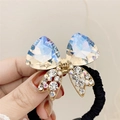 Elastic hair tie featuring crystal bow design with AB iridescent stones and gold frame - Moonlight White