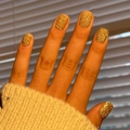 Macro detail of gold glitter press-on nails with shiny textured finish on hands - Pure Gold Glitter