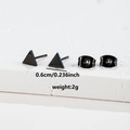 Macro detail of 0.6cm mini black triangle stud earrings with butterfly backings - Triangle Shape (085 Black)