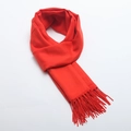 Solid red winter scarf with soft cashmere-like texture and long tassels on white background - Orange Red