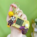 Miniature yellow handheld console game controller keychain with LCD screen and bell - Marvel Game Console - Yellow