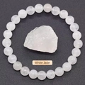 Polished white jade beaded bracelet featuring a raw natural stone center piece - White Jade