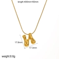 Detail of 18k gold plated H-letter pendant necklace with liquid metal texture design - Letter N