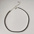 Close-up of S925 sterling silver tennis bracelet with black cubic zirconia and clasp - 925 Silver / Black Zirconia Silver